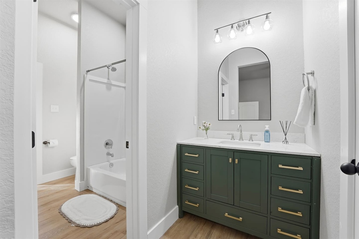 The Jack & Jill bathroom provides a vanity unit to each bedroom 2 & 3 with the shower and toilet being shared 