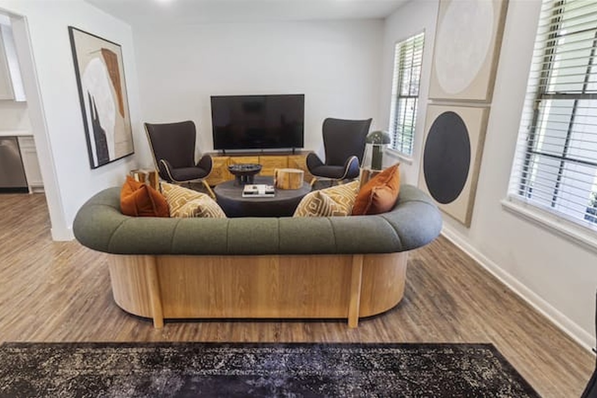 Inviting living space with stylish seating, warm textures, and a cozy atmosphere for gathering and relaxing.