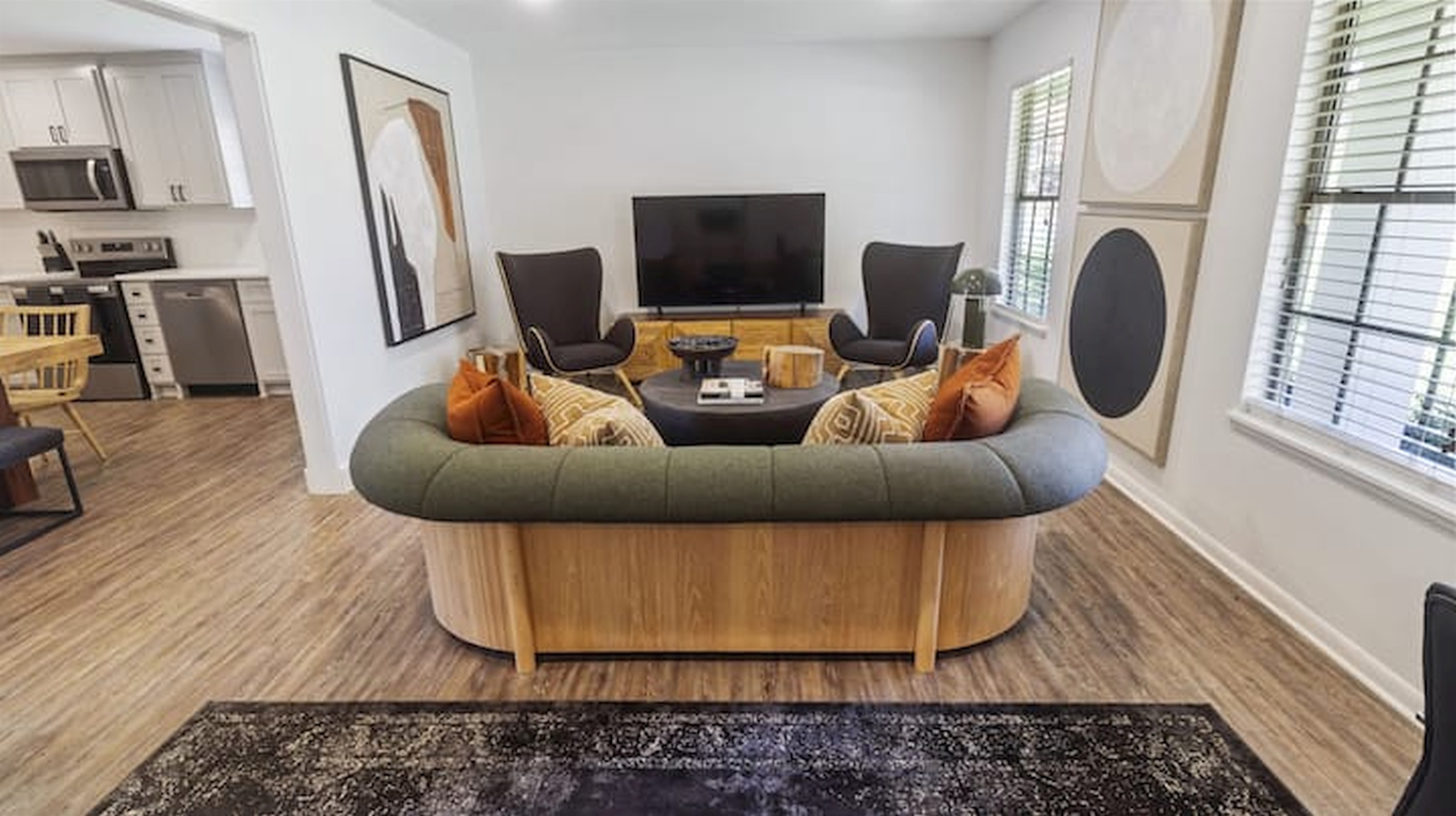 Inviting living space with stylish seating, warm textures, and a cozy atmosphere for gathering and relaxing.