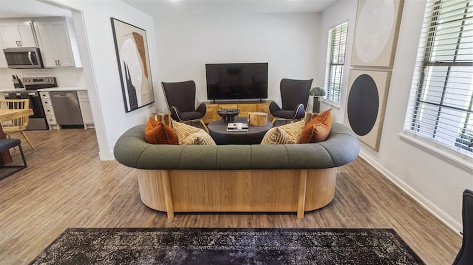 Inviting living space with stylish seating, warm textures, and a cozy atmosphere for gathering and relaxing.