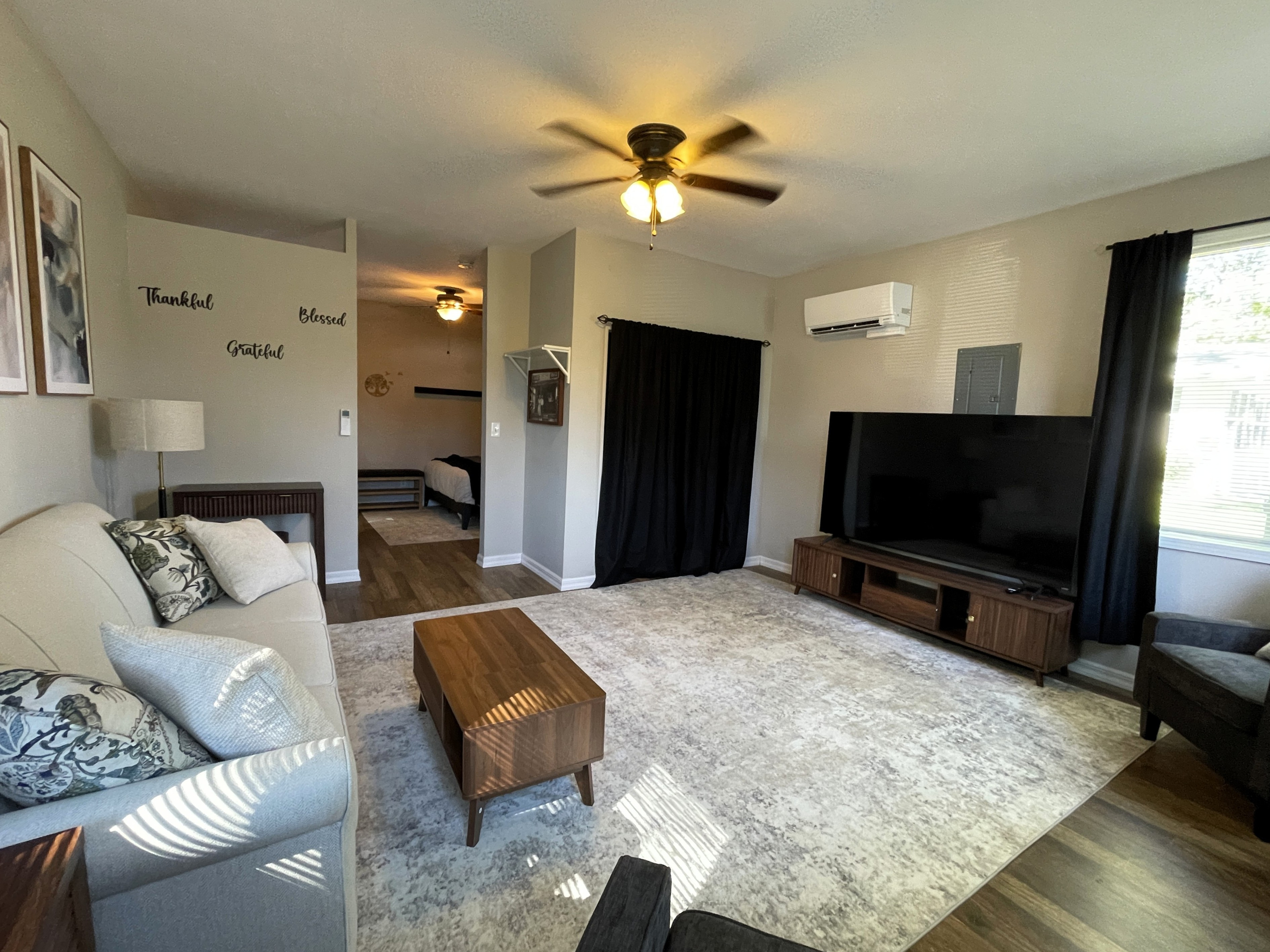 Spacious and Airy Living Room with 75" Smart TV