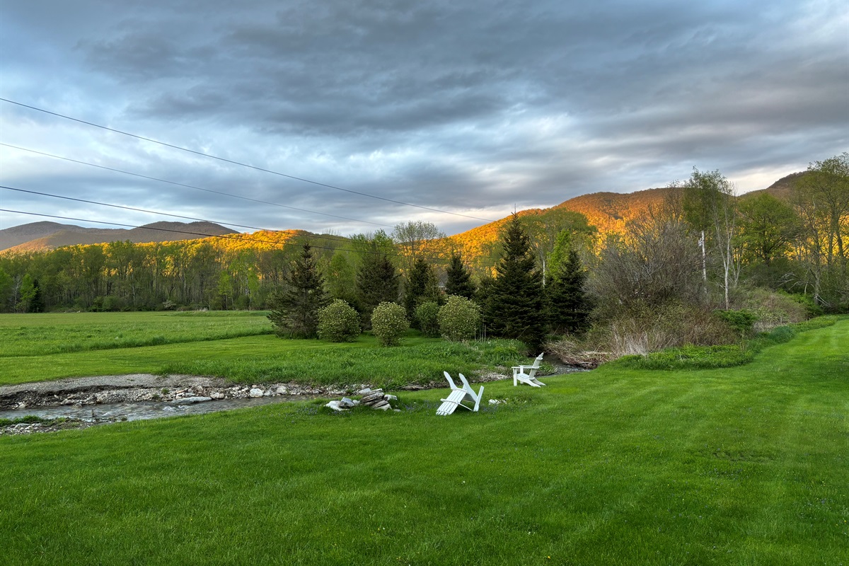 Meadow & Mountain Backdrop

“Rolling fields and mountain backdrop create a peaceful, postcard-worthy setting.”