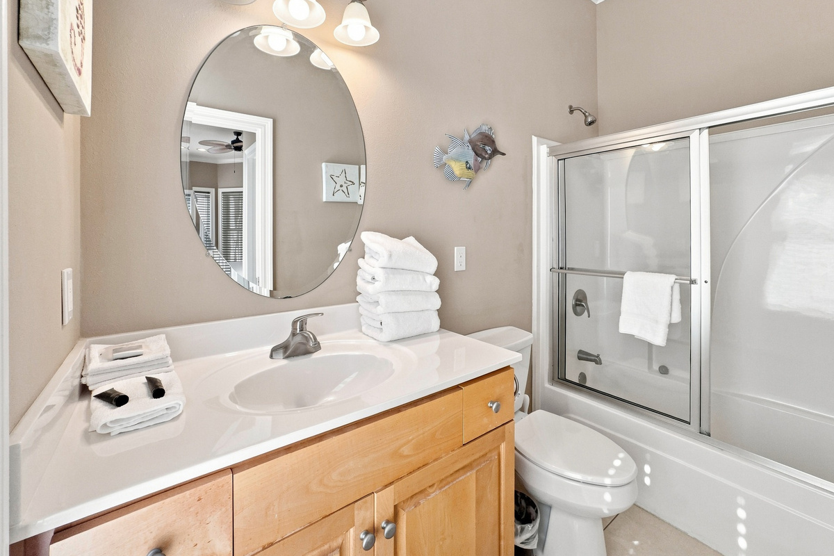 Bathroom with a vanity and glass shower