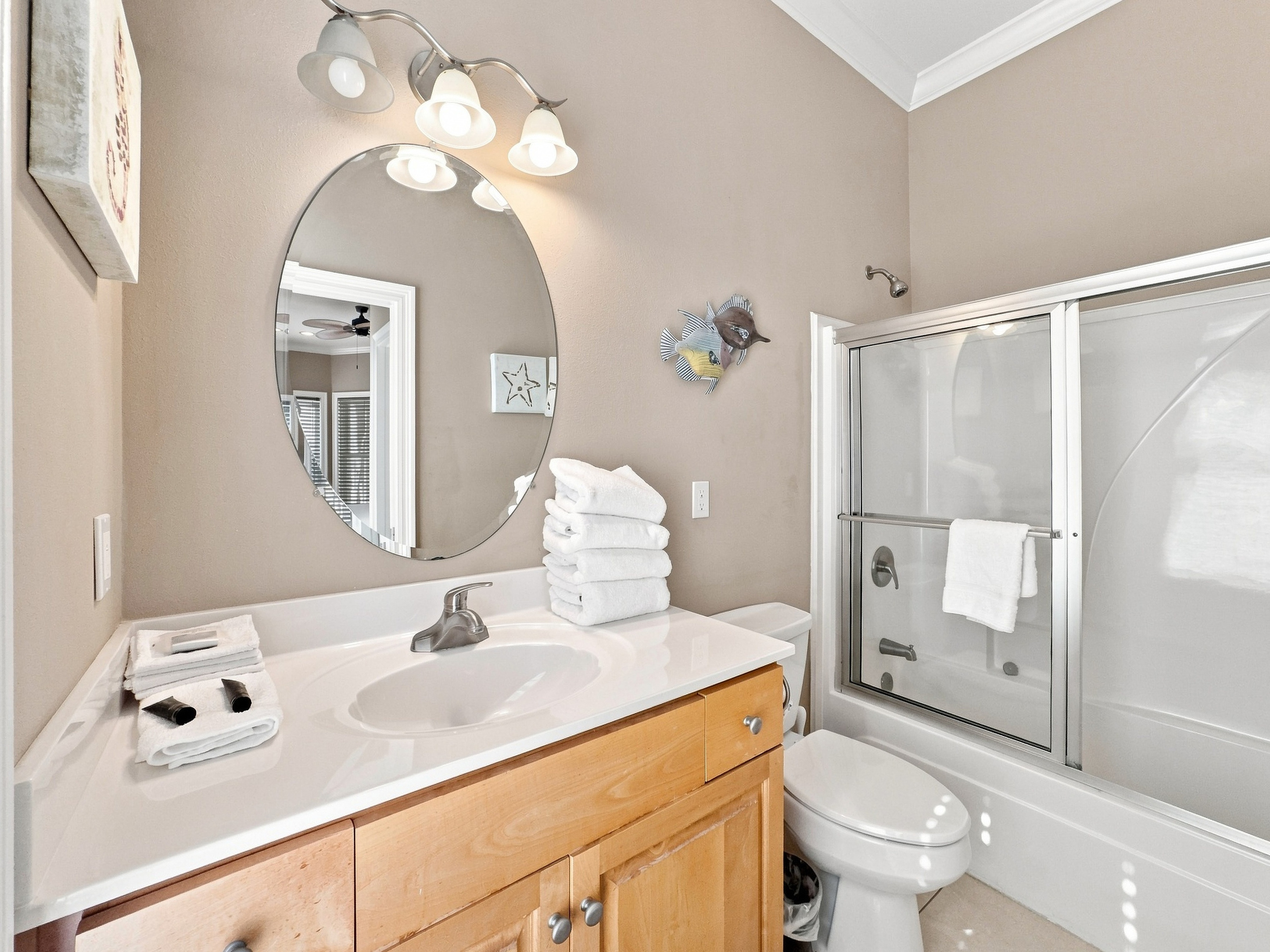 Bathroom with a vanity and glass shower
