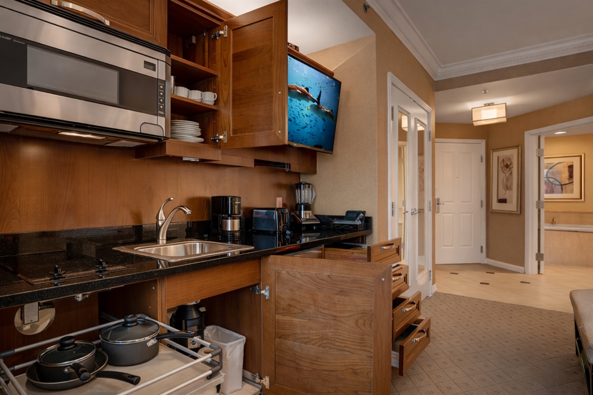 Gourmet Kitchen — Open Layout, Refrigerator, Microwave, Sink, and Full Prep Space