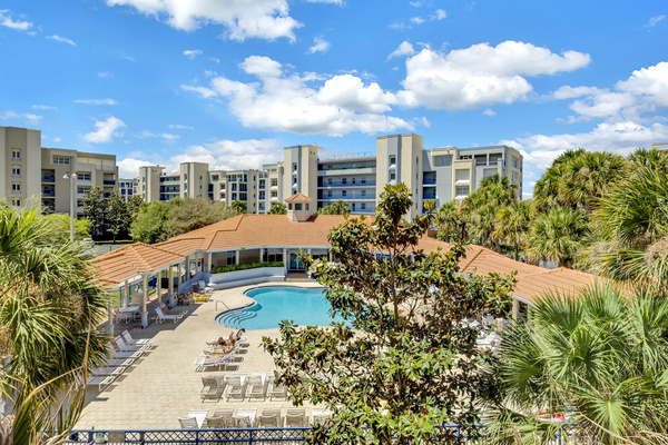 Pool view from front door. Grills available to use at the covered patio.