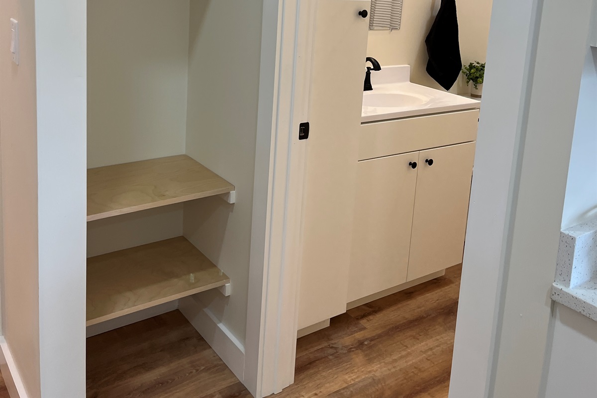 Storage space outside bathroom