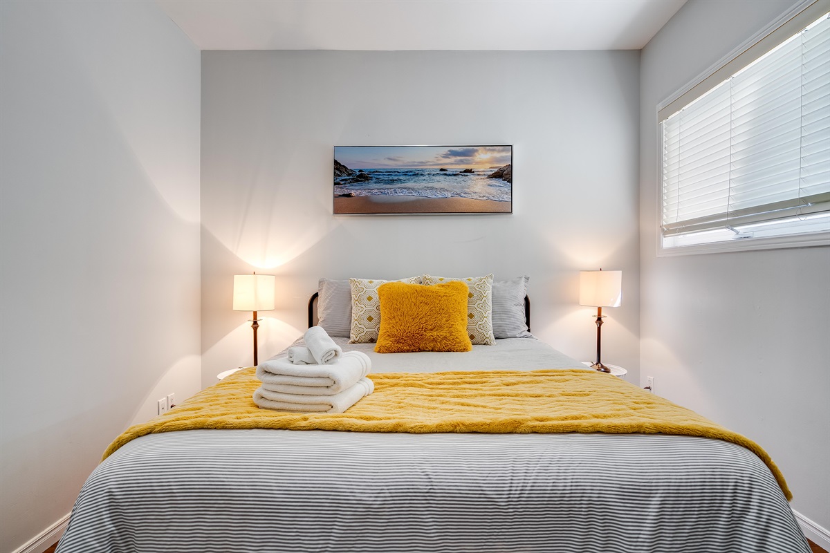 A Queen bedroom with serene primary suite with full lake exposure