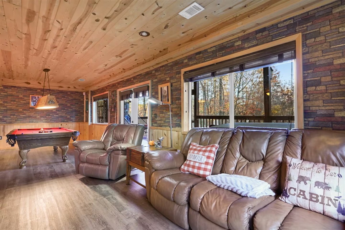 Main games room with pool table, wet bar, tv relaxing area