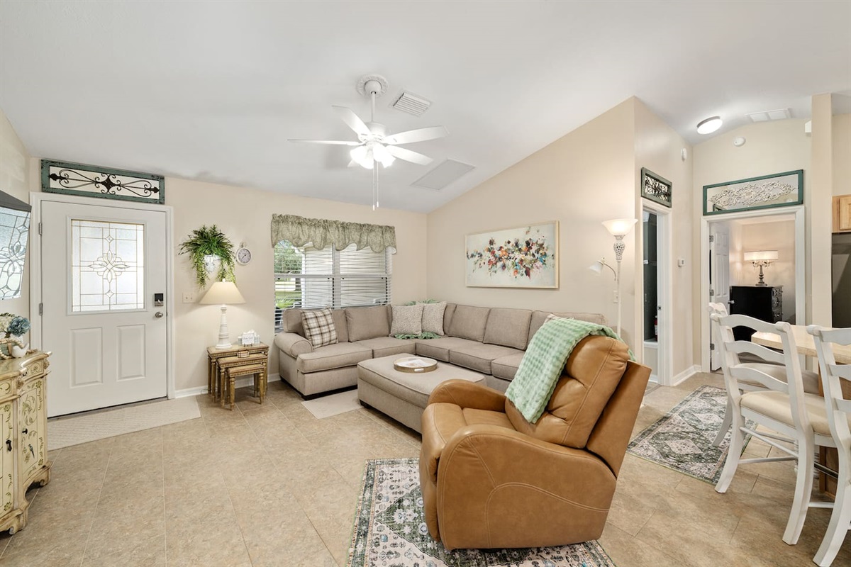 Bright, cozy, and inviting—this comfortable living space is perfect for relaxing after a day of exploring.