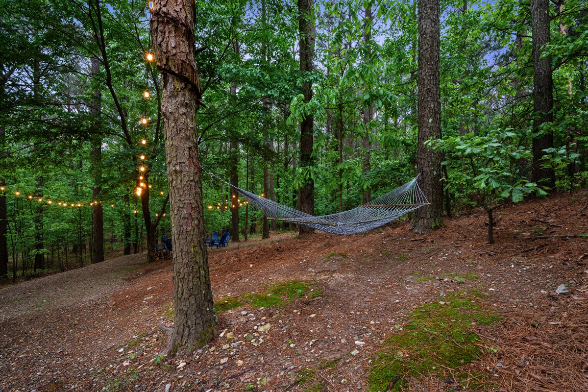 Just by the natural path that winds through the trees is a hammock, adding to the sense of privacy and connection to nature.