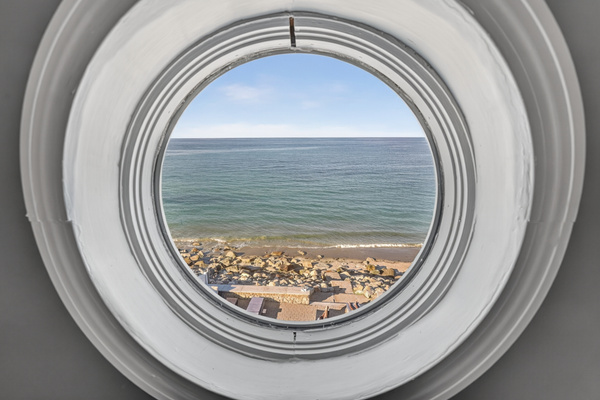 Enjoy beautiful water views through this unique porthole window.
