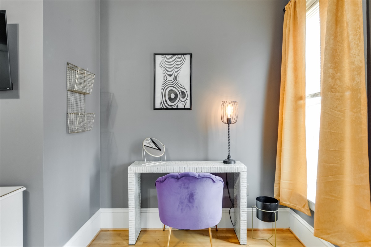 Workspace in Queen Bedroom 2: Trendy desk, stylish lighting, and vibrant decor create the perfect work vibe!