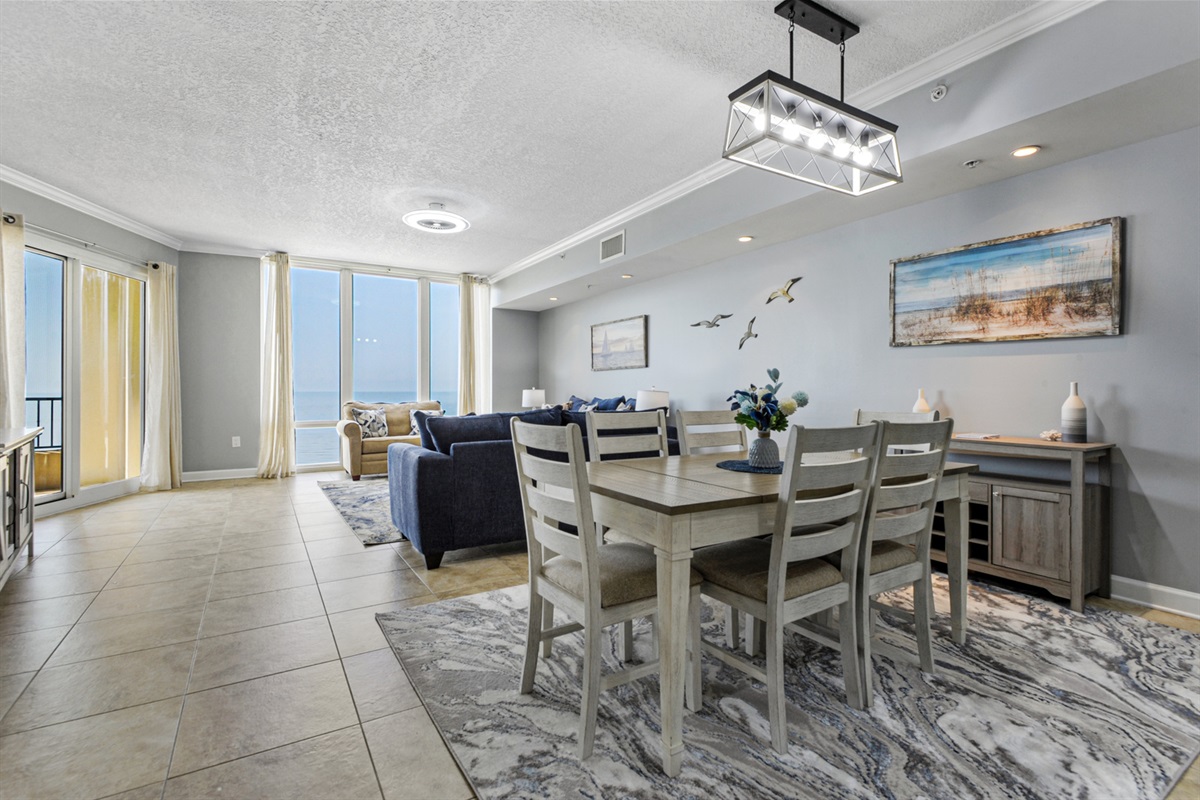 Looking into dining, living balcony, and full floor to ceiling windows.