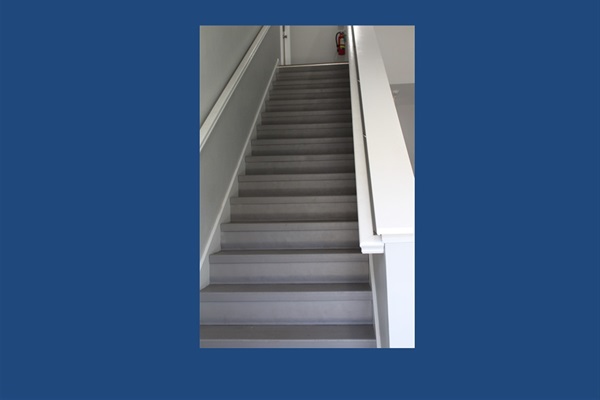 There is 1 flight of stairs from the front door down to the condo entrance.