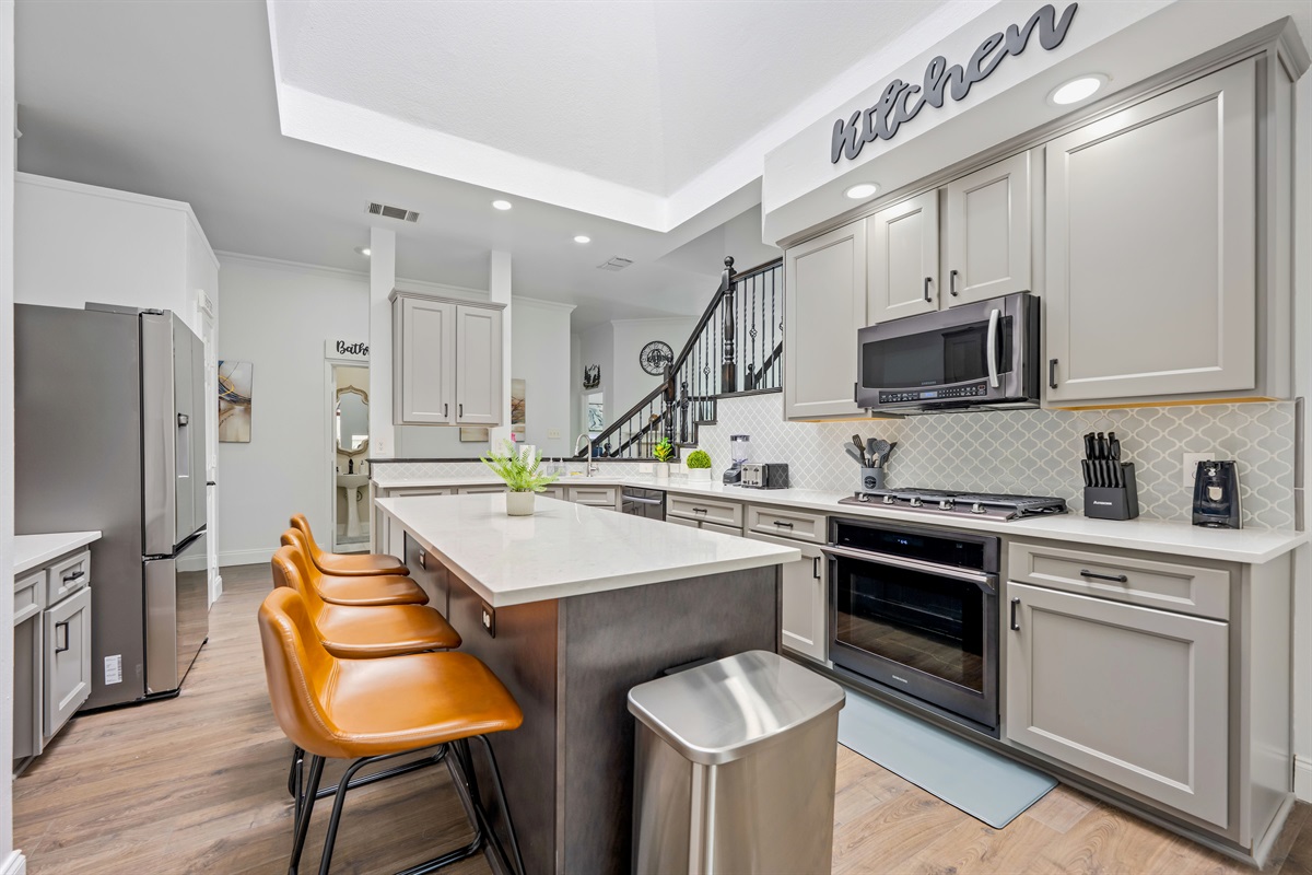 Gourmet kitchen with stainless appliances & fully stocked amenities for group cooking