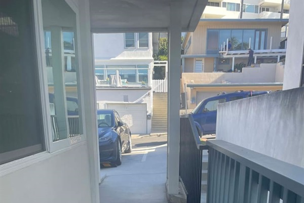 One 4.5 inch step up from condo to parking area.