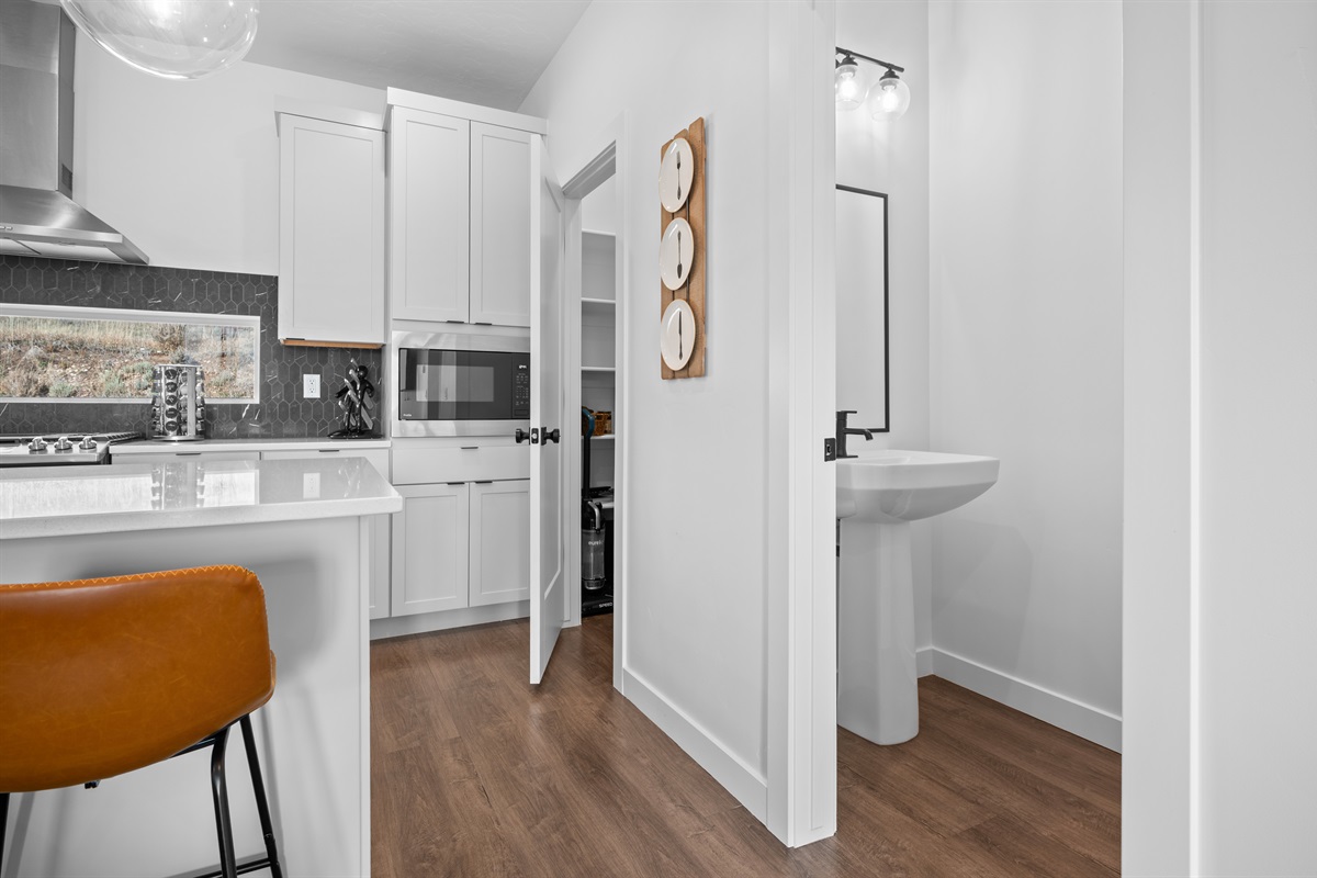 Main-level half bath for guest convenience.