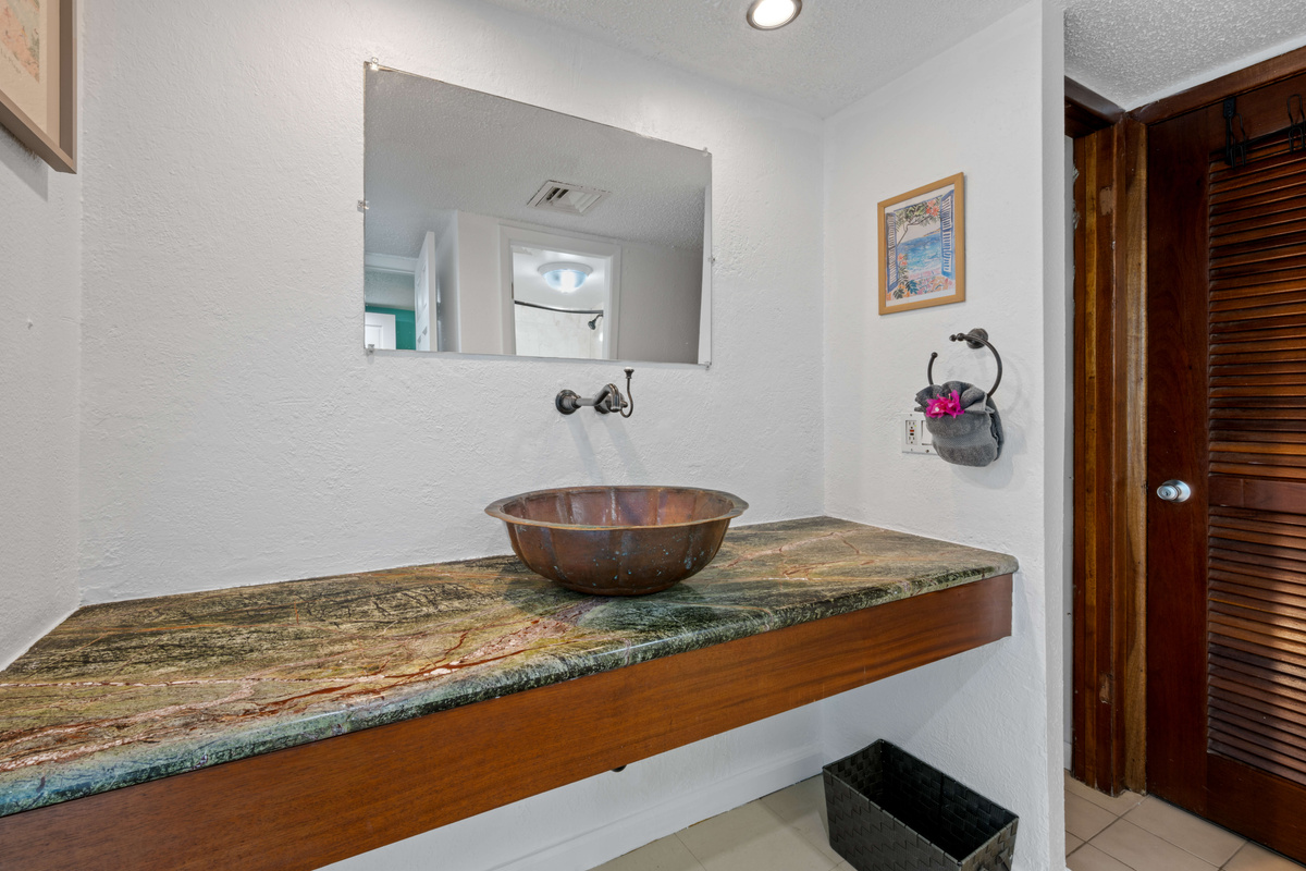 Bright bathroom vanity area with a comfortable, clean feel.