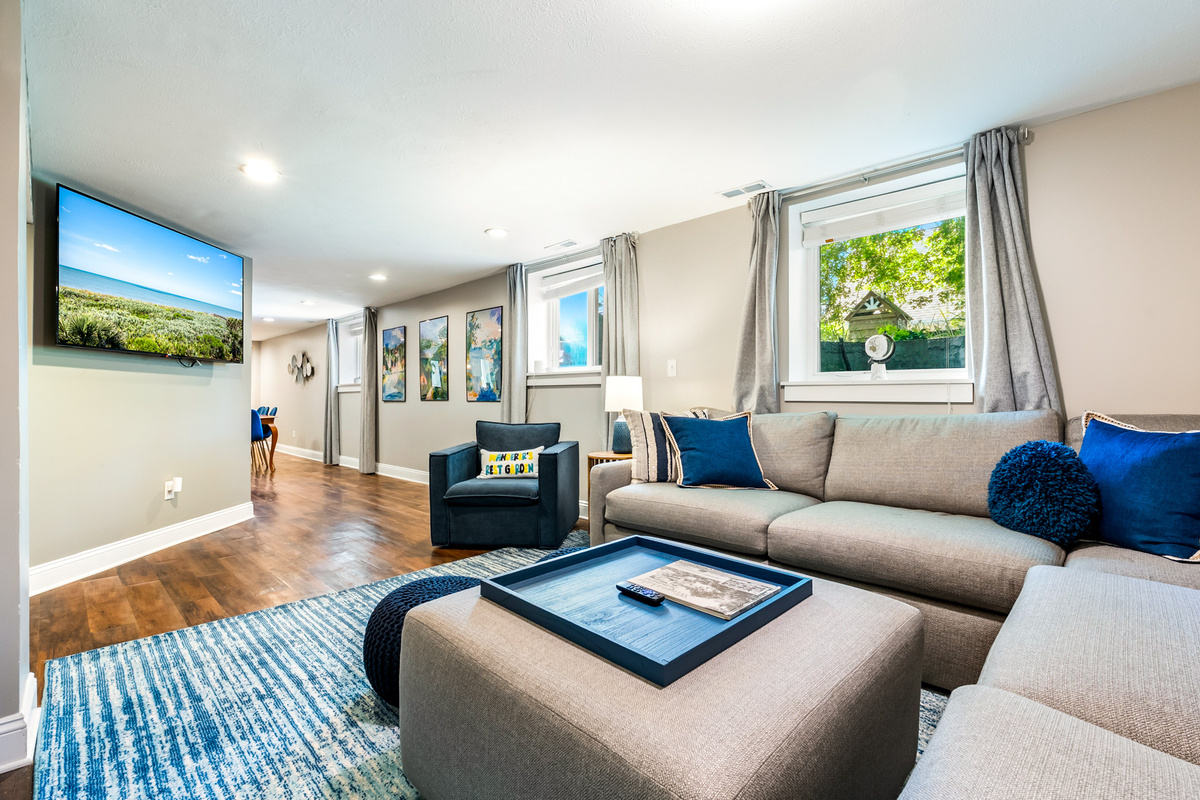 Unwind in style. The garden suite's living room features a large, plush sectional sofa with plenty of seating for the whole family to gather around the flat-screen Roku Smart TV for movie nights.
