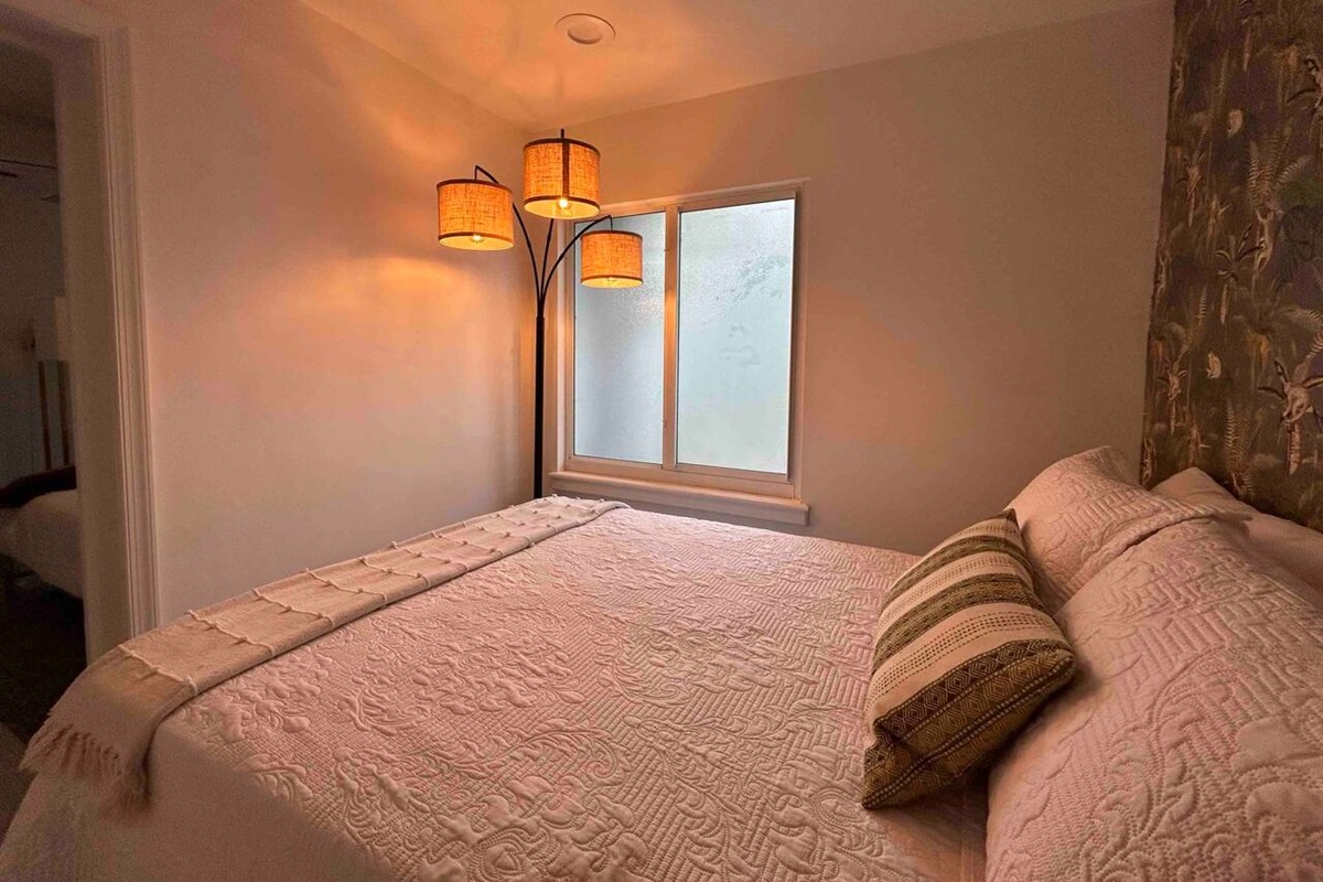 The cozy rear bedroom is our favorite! A tranquil, quiet bedroom that connects through the master bedroom. Families love this room!