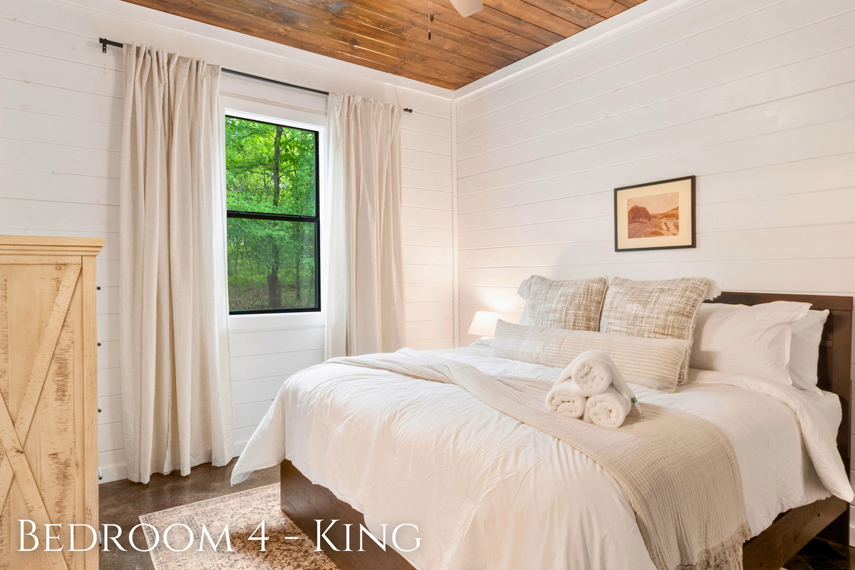 Unwind in this king bedroom where the plush bedding and serene views will lull you into a deep sleep, recharging you for another day of adventure.