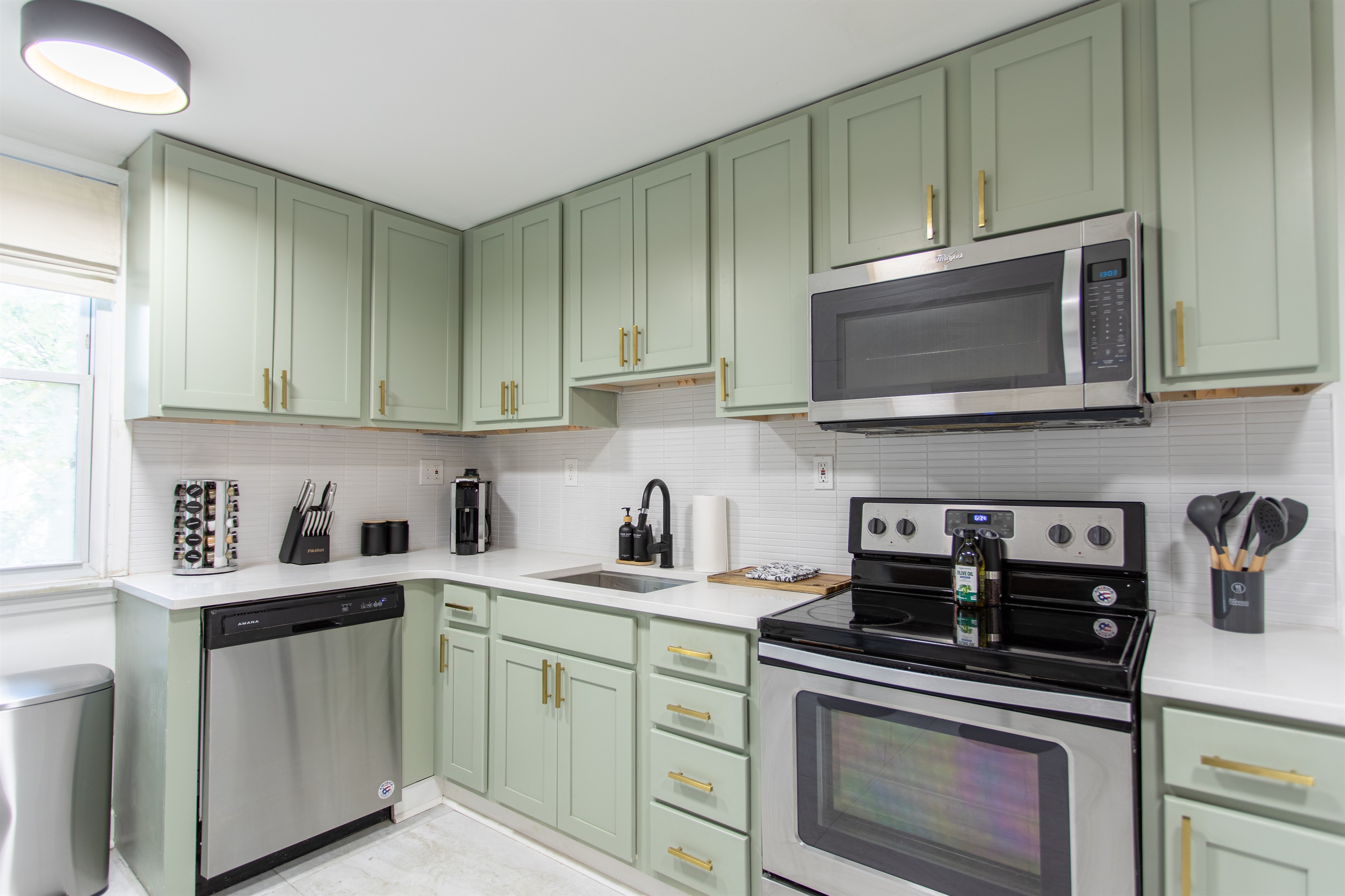 Spacious full kitchen featuring stainless steel and modern appliances.