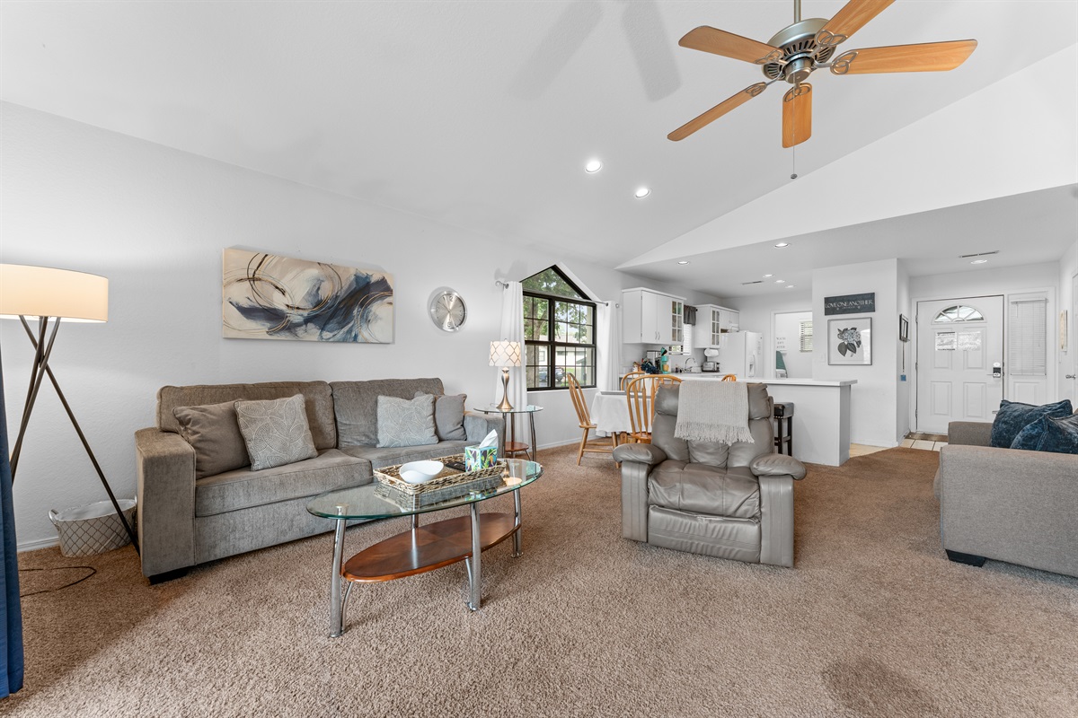 Another full-room angle that helps show the condo’s roomy layout and vaulted, airy feel.