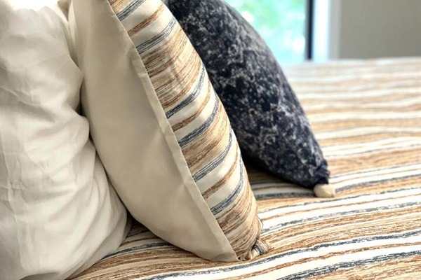 Quality bedding, extra pillows, and blankets for a restful night's sleep. 