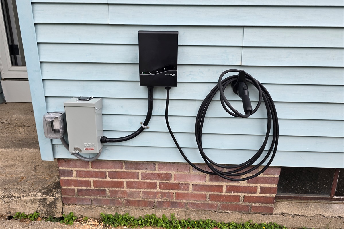 Charge with ease—our EV charger is conveniently located right next to the side entrance and driveway, making arrivals and departures smooth and powered up.