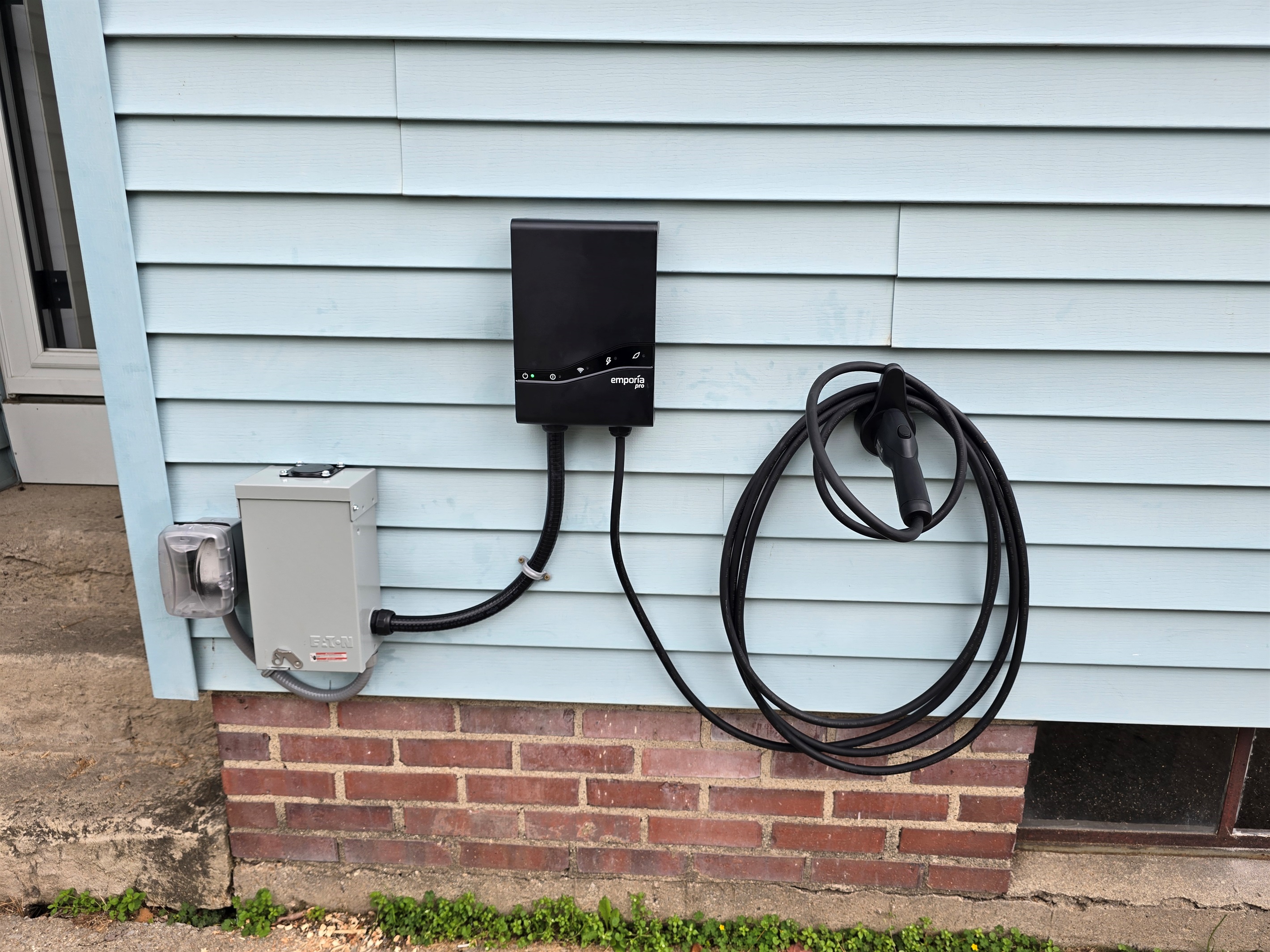 Charge with ease—our EV charger is conveniently located right next to the side entrance and driveway, making arrivals and departures smooth and powered up.