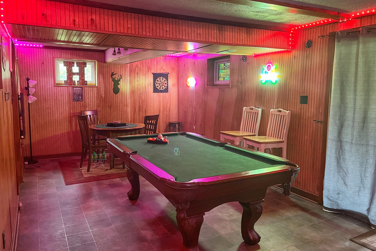 Relax downstairs with a game of pool or gather around the game table for cards, board games, or puzzles—the perfect spot to unwind after a day at the river.
