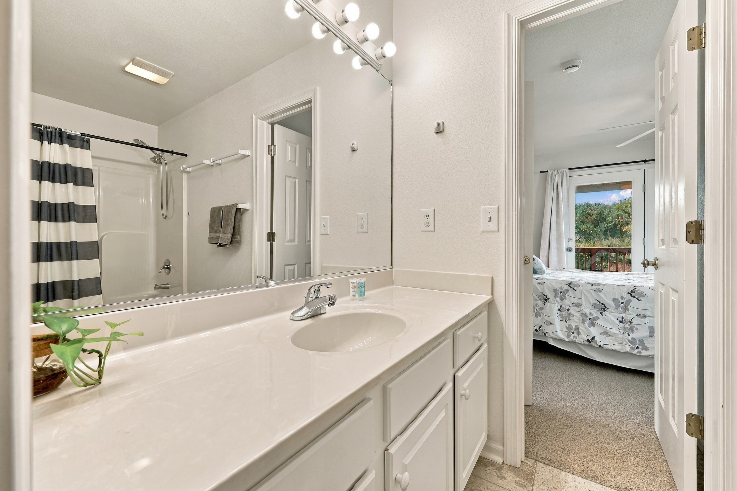 Jack-and-Jill bath with a tub/shower combo, connecting two of the bedrooms.
