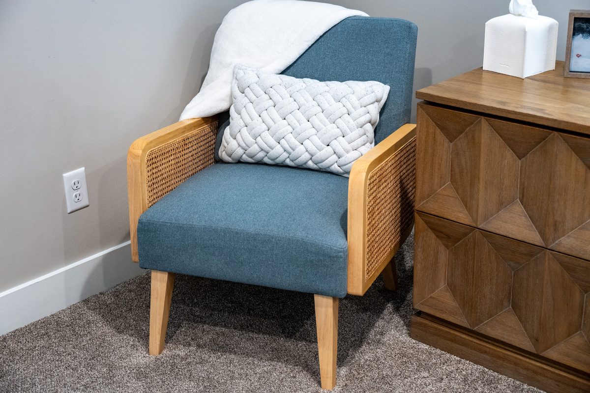 Cozy reading chair creates the perfect spot to enjoy a morning coffee, catch up on a book, or simply unwind.