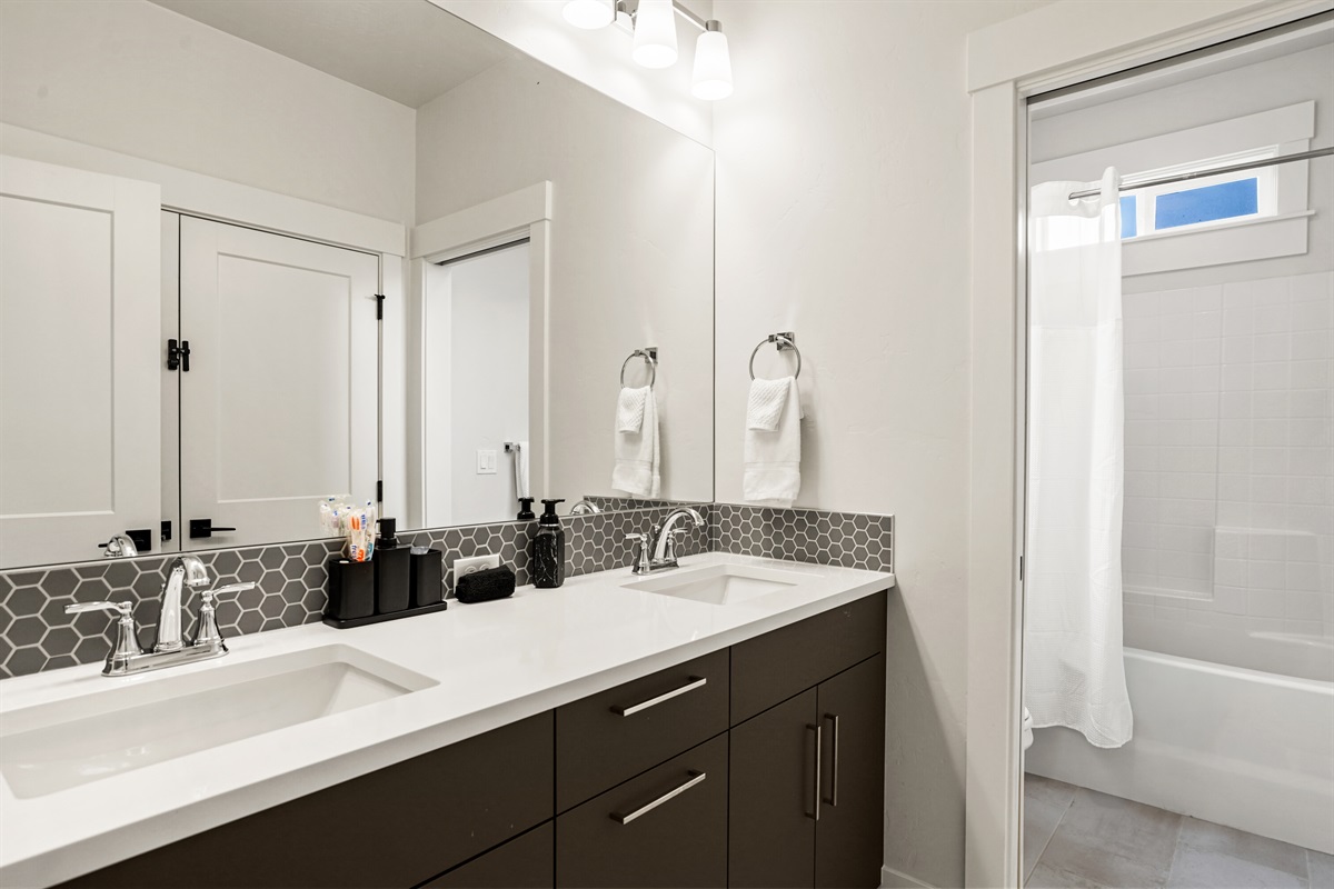 Sleek double vanity bathroom featuring modern fixtures and clean finishes.