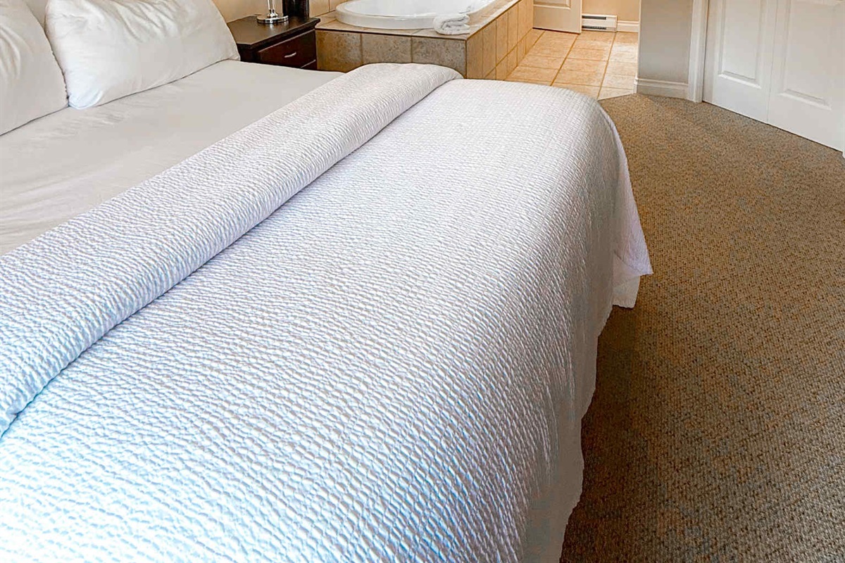 Unit A - primary bedroom - view on in room soaker tub!