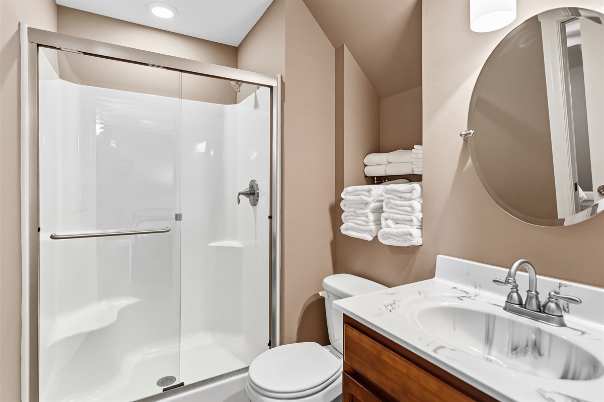 Upstairs full bath with tub & shower. Light, bright, and fully stocked for your stay.
