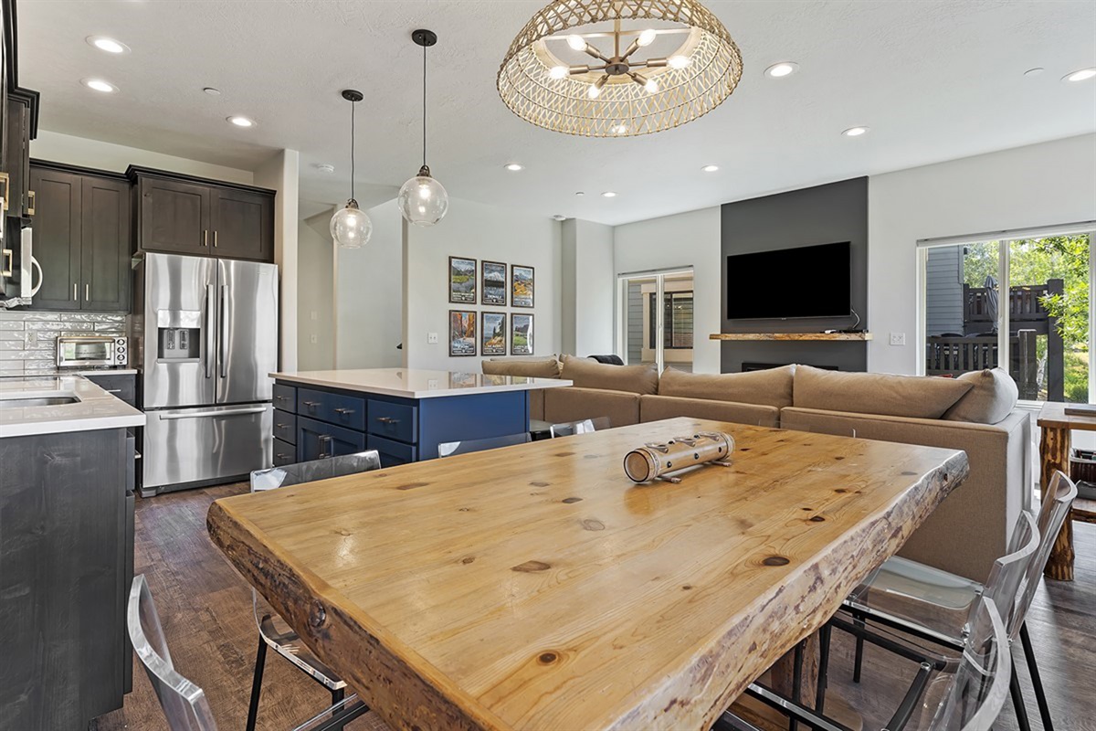 An airy, sophisticated dining space flows effortlessly into the kitchen and living areas, creating a refined atmosphere for entertaining.