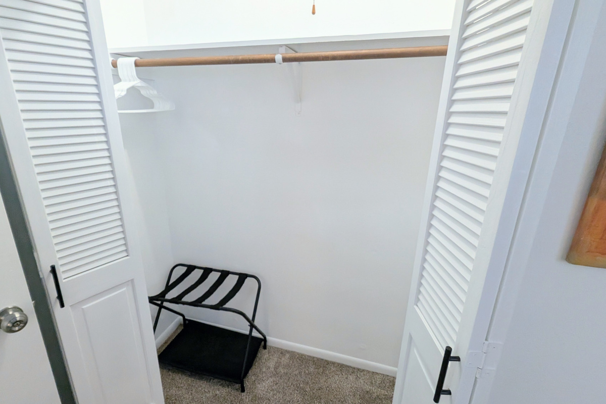 The closet is well equipped with plenty of hangers and a convenient luggage rack for your suitcase. 
