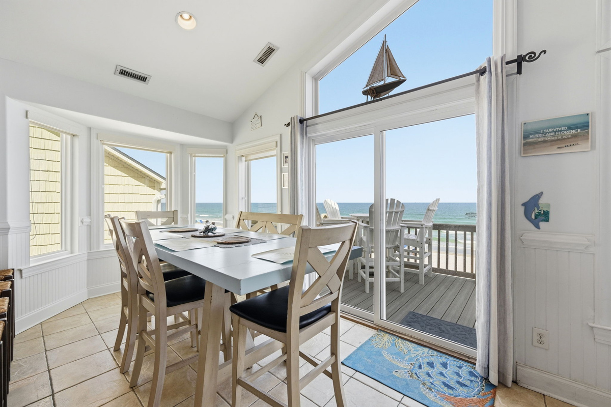 Light-filled dining area opening directly to the ocean breeze and outdoor seating