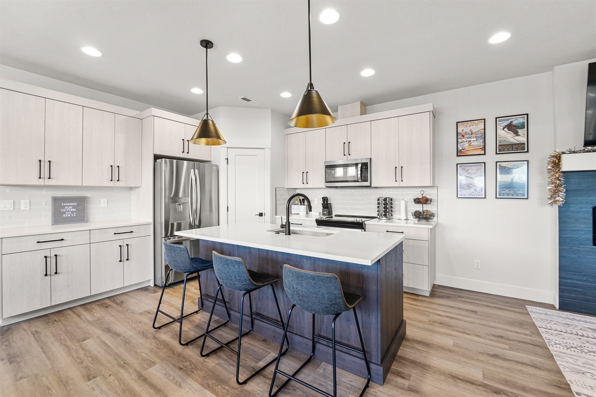 Modern kitchen with stainless steel appliances and a spacious island for cooking and gathering