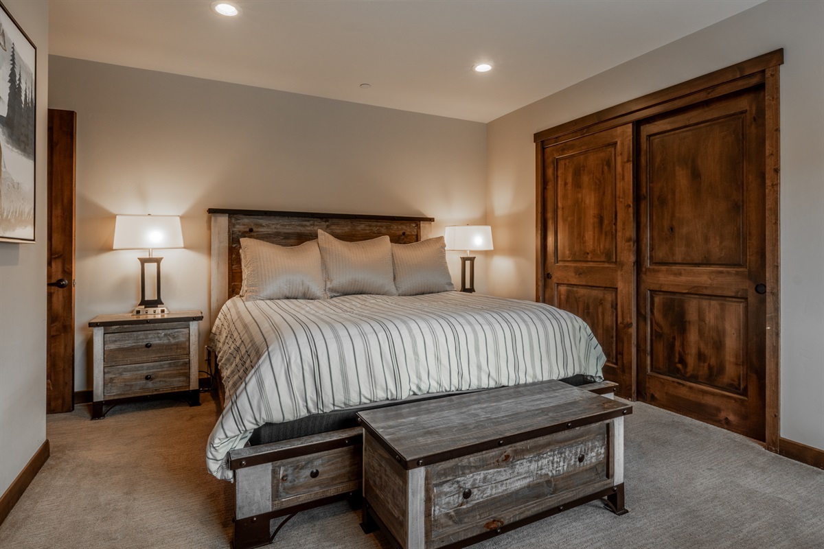 Perched on the top level for added privacy, the primary suite offers beautiful natural light, elevated views, and a serene alpine feel.