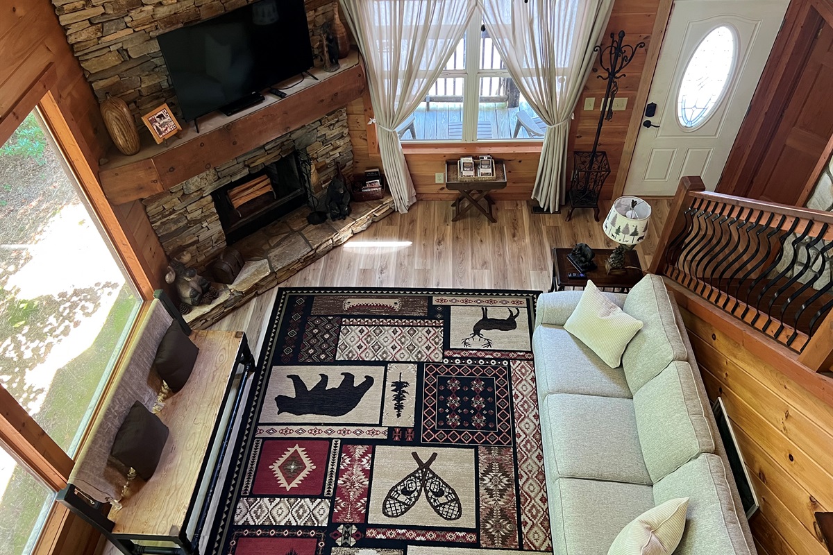 Breathe in the space — high ceilings, warm wood, and a      fire that feels like home.”