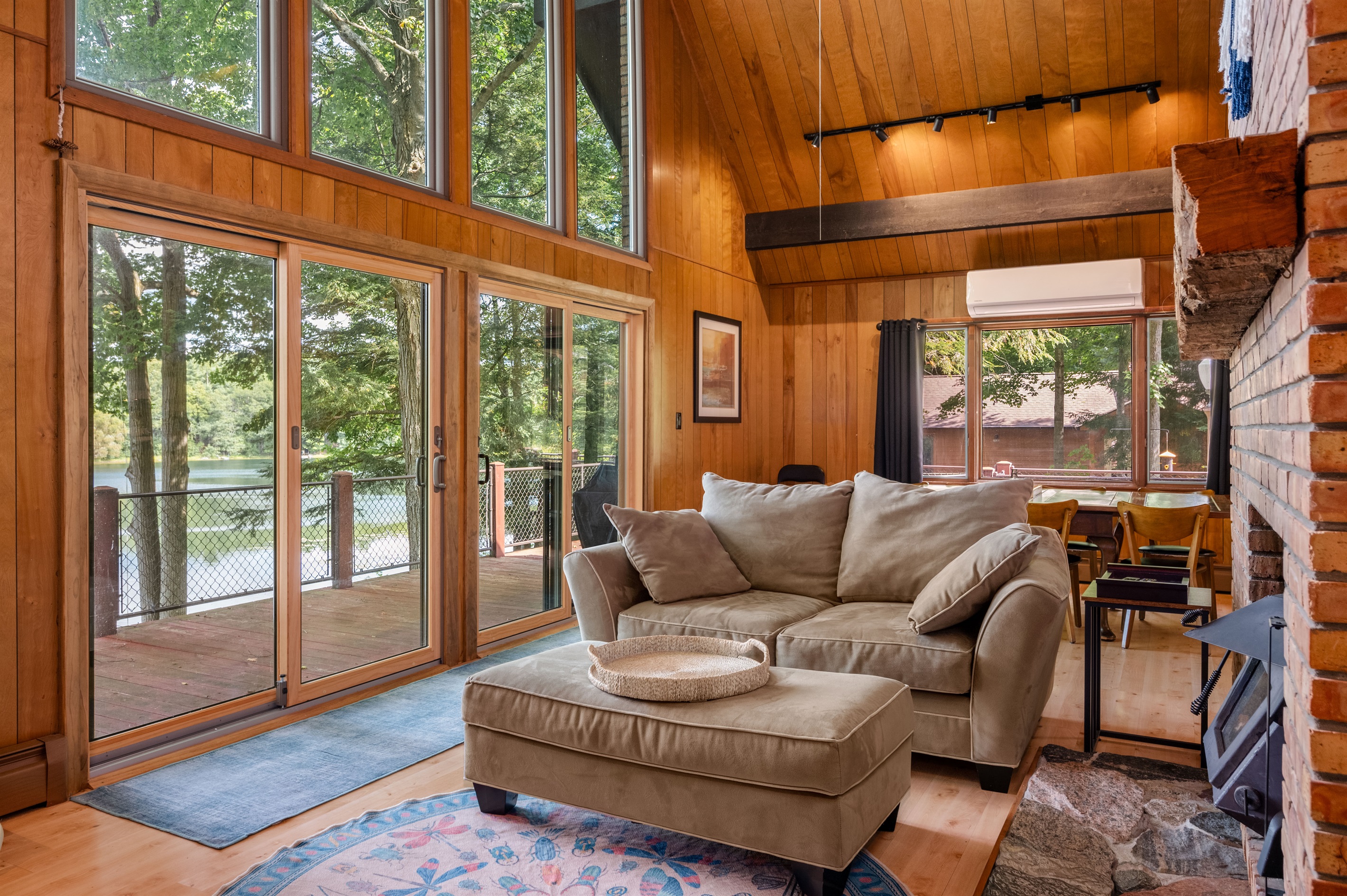Cozy seating area with fireplace and access to the deck