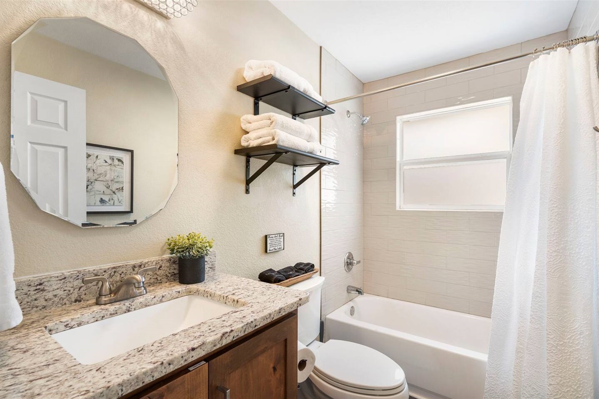 Upper-level bath with shower/tub combo - ideal for families.