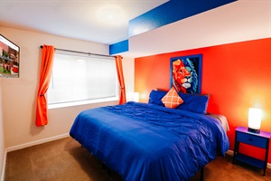 Bedroom beauty from every angle! Vibrant orange walls and serene blue accents create a harmonious retreat, while a touch of wildlife adds a dash of personality. 🦁🎨 #ColorfulComfort #BedroomEscape