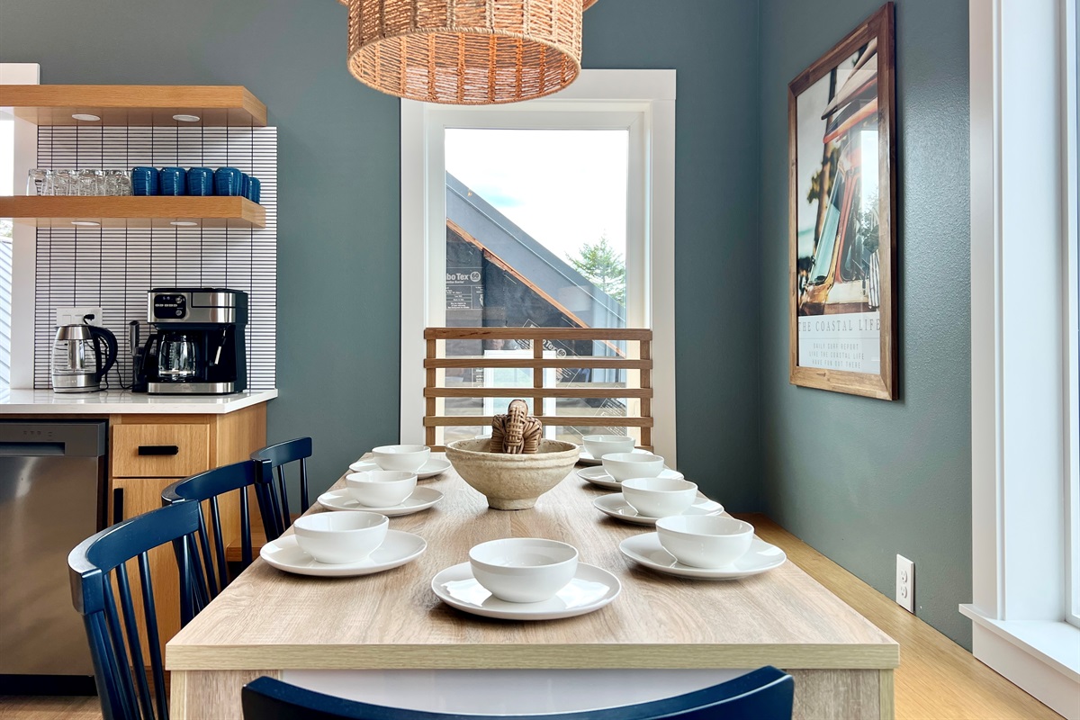 27 Villa B dining — gather around for meals, game nights, or a bottle of wine that runs long.