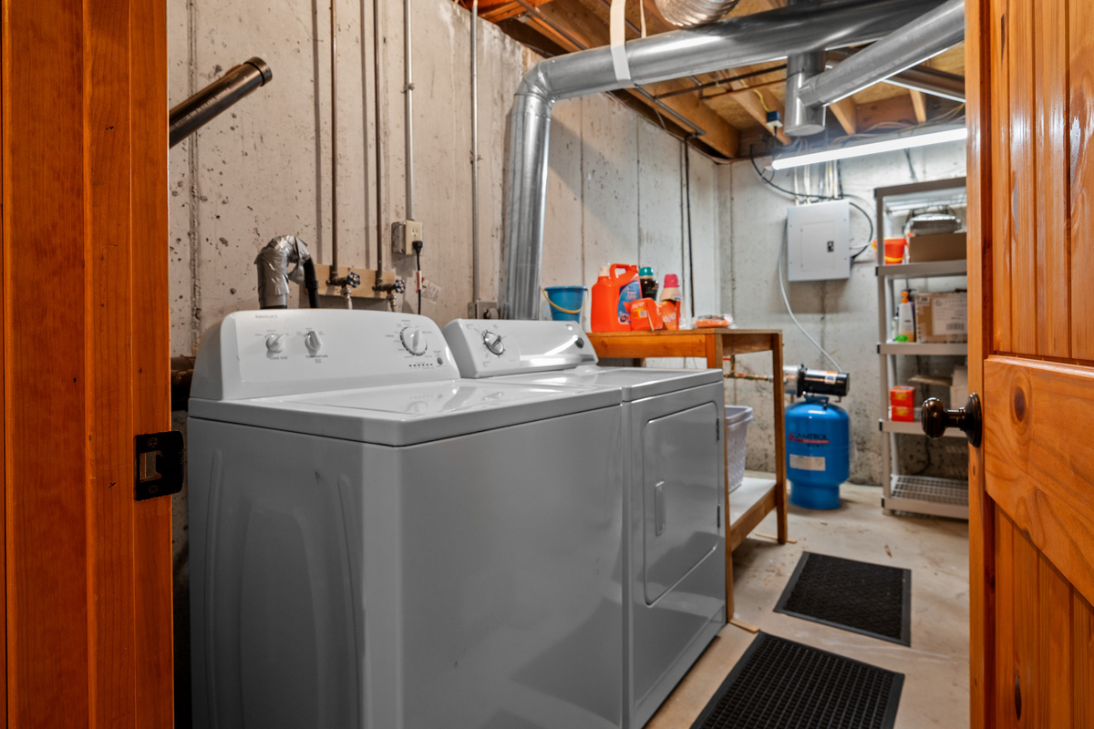 Separate laundry room with washer and dryer for added convenience during longer stays.
