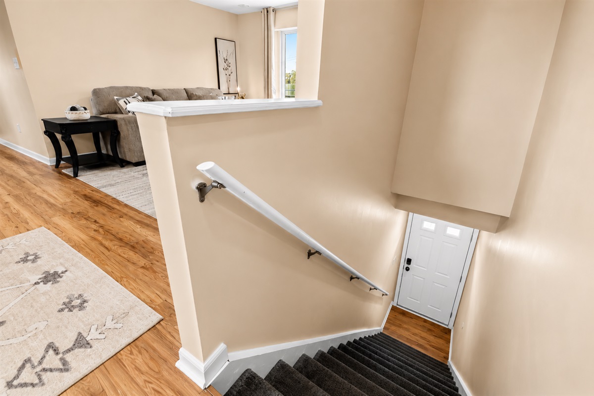 Thoughtfully designed split-level layout with easy access between spaces, featuring warm wood flooring and a bright, modern interior throughout.