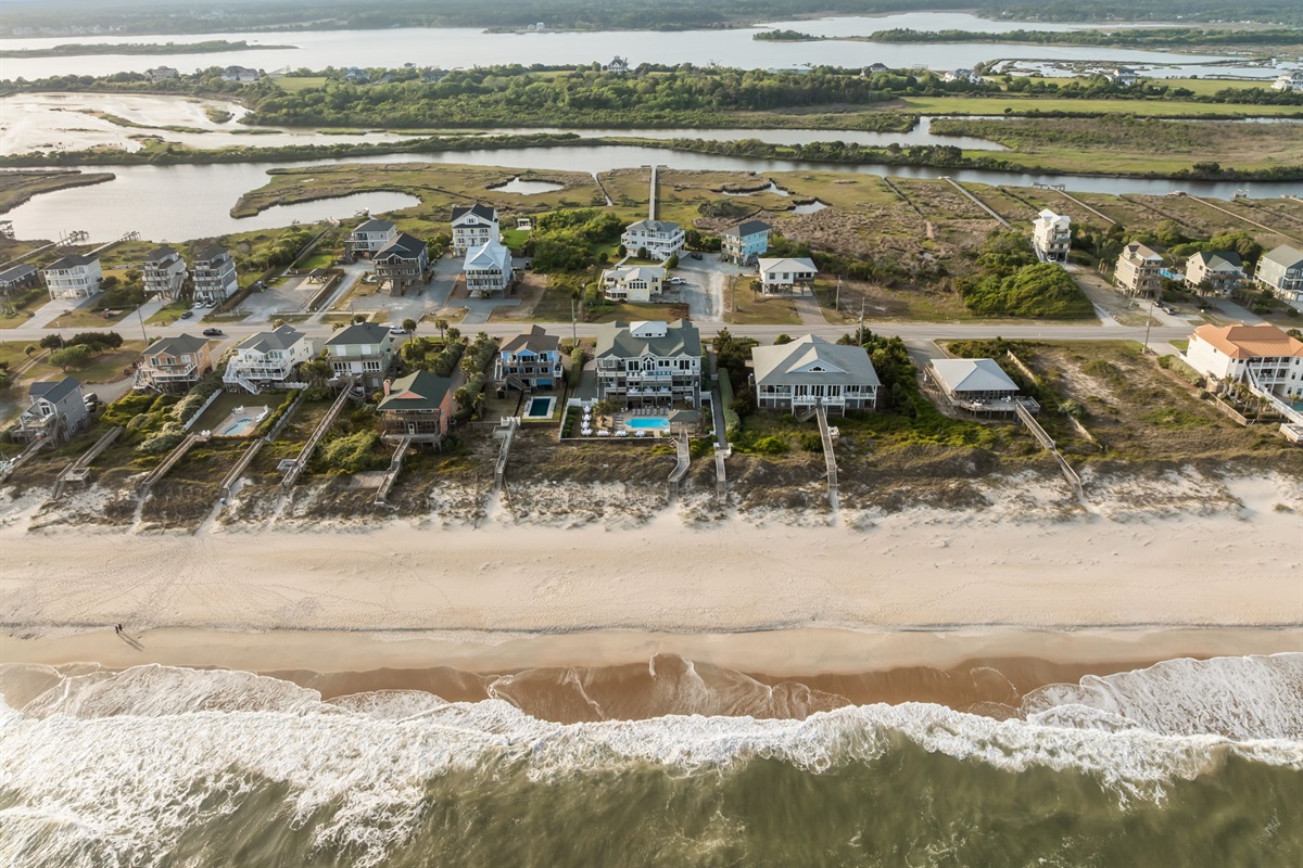 Prime coastal location with direct beach access and stunning shoreline views